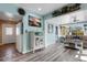 Relax in the charming living room with beachy decor, lovely views, and comfortable seating at 1985 Fairview Dr, Englewood, FL 34223
