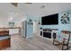 Open-concept living space features modern appliances, updated lighting, and beautiful wood-look flooring at 1985 Fairview Dr, Englewood, FL 34223