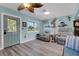 Inviting living room with coastal decor, two recliners, and wood-look flooring at 1985 Fairview Dr, Englewood, FL 34223
