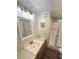 Bathroom vanity and sink, shower with sliding glass door, and tile flooring at 28 Castaway Ct, North Port, FL 34287