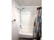 Clean shower and tub featuring white wall surround, chrome fixtures and a decorative shower curtain at 28 Castaway Ct, North Port, FL 34287