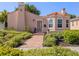 Charming home featuring a tile roof, stucco exterior, and landscaped front yard at 321 Pedro St, Venice, FL 34285
