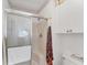Clean bathroom featuring a shower with glass doors at 3300 Loveland Blvd # 1504, Punta Gorda, FL 33980