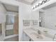 Clean bathroom with a shower and neutral-toned countertop at 3300 Loveland Blvd # 1504, Punta Gorda, FL 33980