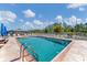 Inviting community pool with lounge chairs and umbrellas, perfect for relaxation and socializing at 3300 Loveland Blvd # 1504, Punta Gorda, FL 33980