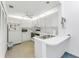 Bright white kitchen featuring modern appliances and ample counter space at 3300 Loveland Blvd # 1504, Punta Gorda, FL 33980