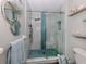 Modern bathroom with glass shower enclosure, decorative mirrors, and upscale fixtures at 335 Englewood Isles Pkwy # 55, Englewood, FL 34223