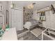 Charming bedroom with a cozy bed, decorative shelves, and plenty of natural light at 335 Englewood Isles Pkwy # 55, Englewood, FL 34223