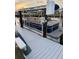 View of pontoon boat on dock with boat lift showing a 'Sweetwater' boat ready for Florida waters at 335 Englewood Isles Pkwy # 55, Englewood, FL 34223