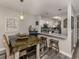Eat-in kitchen with breakfast bar that offers seamless flow and ample space for cooking and entertaining at 335 Englewood Isles Pkwy # 55, Englewood, FL 34223