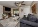 Inviting living room with whitewashed brick, fireplace, and neutral tones, offering a cozy and stylish space at 335 Englewood Isles Pkwy # 55, Englewood, FL 34223