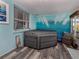 Enclosed patio featuring a hot tub, providing a private and relaxing retreat within the home at 335 Englewood Isles Pkwy # 55, Englewood, FL 34223