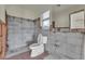 Bathroom awaiting renovation with existing toilet and mirror fixtures in a bright space at 833 White Cap Cir # 8, Venice, FL 34285