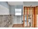 Bathroom features concrete block construction, modern fixtures and a window at 833 White Cap Cir # 8, Venice, FL 34285
