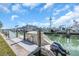 Boat docked on a picturesque waterway with waterfront views, blue skies and boats at 833 White Cap Cir # 8, Venice, FL 34285
