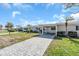 Well-maintained one-story home with a covered parking area and a beautiful tree-lined street at 833 White Cap Cir # 8, Venice, FL 34285