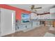 Renovated kitchen featuring white cabinets, a window, and durable wood-look flooring at 833 White Cap Cir # 8, Venice, FL 34285