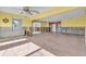 Spacious living room features wood-look tile floors and bright, natural light at 833 White Cap Cir # 8, Venice, FL 34285