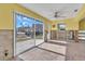 Open living room with lots of natural light from sliding glass doors and adjacent rooms at 833 White Cap Cir # 8, Venice, FL 34285