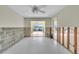 Bright living room offers a seamless transition with sliding glass doors and a clear view at 833 White Cap Cir # 8, Venice, FL 34285