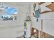 Utility room with water heater and storage shelves at 833 White Cap Cir # 8, Venice, FL 34285
