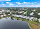 Community view featuring lakefront properties, lush landscaping, and serene surroundings at 900 Paisley Ct # 1, Venice, FL 34293