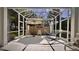 Screened patio with comfortable seating and a hammock, perfect for relaxing outdoors at 900 Paisley Ct # 1, Venice, FL 34293