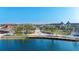 Aerial view of the vibrant Downtown Wellen Park with a lakefront promenade and lush green spaces at 11571 Gleaming Ter, Venice, FL 34293