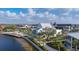 An aerial view of the community's beautiful lakefront area and commercial area, perfect for an evening stroll at 11571 Gleaming Ter, Venice, FL 34293