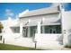An exterior view of the well-designed community clubhouse, featuring elegant design and architecture at 11571 Gleaming Ter, Venice, FL 34293