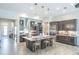Stylish kitchen with a large center island, stainless steel appliances, and pendant lighting at 11571 Gleaming Ter, Venice, FL 34293