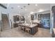 Open kitchen boasts an island with seating, modern appliances, and a view of the staircase at 11571 Gleaming Ter, Venice, FL 34293