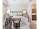 Serene main bedroom with tray ceilings and elegant furnishings at 11571 Gleaming Ter, Venice, FL 34293