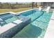 Sparkling pool with an integrated spa and two chairs inside the pool at 11571 Gleaming Ter, Venice, FL 34293