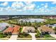 An aerial view highlights this home's desirable location, featuring a serene lake and neighborhood setting at 1282 Reserve Dr, Venice, FL 34285