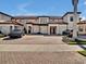 Charming condos featuring private garages and brick-paved driveways, complemented by neatly manicured landscaping at 23108 Banbury Way # 202, Venice, FL 34293