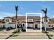 Spacious condos with terracotta tile roofs and paved driveways, perfect for relaxed community living with tropical landscaping at 23108 Banbury Way # 202, Venice, FL 34293