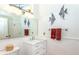 Bathroom with a white vanity, large mirror, and tile walls at 237 Southampton Ln # 275, Venice, FL 34293