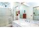 Bathroom featuring a glass shower, modern sink, and sleek fixtures at 237 Southampton Ln # 275, Venice, FL 34293