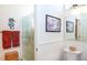 Clean bathroom featuring a glass-enclosed shower and crisp, white tile at 237 Southampton Ln # 275, Venice, FL 34293