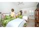 Bedroom with two twin beds, white shutters, and a ceiling fan at 237 Southampton Ln # 275, Venice, FL 34293