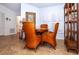 Bright breakfast nook with wicker chairs, shuttered windows, and tile floors at 237 Southampton Ln # 275, Venice, FL 34293
