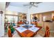 Bright dining room with table set for four, leading into living room and lanai at 237 Southampton Ln # 275, Venice, FL 34293