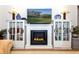 Cozy fireplace with built-in shelves, perfect for displaying decor and providing warmth at 237 Southampton Ln # 275, Venice, FL 34293