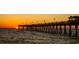 Sunset view of a fishing pier stretching over the ocean, with people fishing as the sun sets in the distance at 237 Southampton Ln # 275, Venice, FL 34293