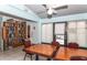 Community library with a large bookshelf and a table with red chairs, providing an area for reading at 237 Southampton Ln # 275, Venice, FL 34293