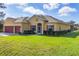 Charming single-Gathering home with a neatly landscaped front yard and a convenient two-car garage at 2737 Cottage Ln, North Port, FL 34286