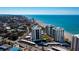 Aerial view of beachfront condos with stunning ocean views, set on a prime coastal location at 627 Alhambra Rd # 601, Venice, FL 34285