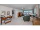 Comfortable living room with ceiling fan, desk, cabinets, plenty of seating and expansive views of the water at 627 Alhambra Rd # 601, Venice, FL 34285