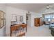 Spacious and bright living room with ceiling fan, desk, cabinets, comfortable seating and ocean views at 627 Alhambra Rd # 601, Venice, FL 34285